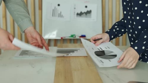 Financial Professionals Analyzing Data in Office