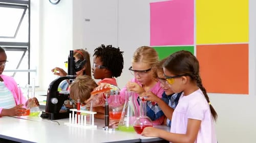 Children Doing Science Experiment in Classroom