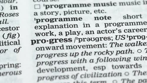 Close Up of Word "Progress" in Dictionary