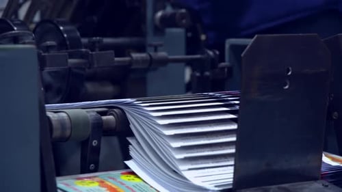 Industrial Machine Printing Sheets of Paper
