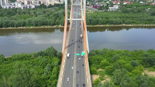 Car driving on highway bridge and road intersection in modern city aerial view