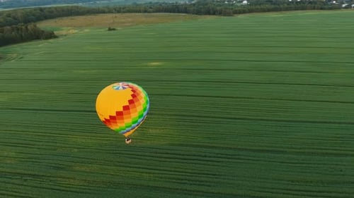 Hot Air Balloon in the Sky Over a Field