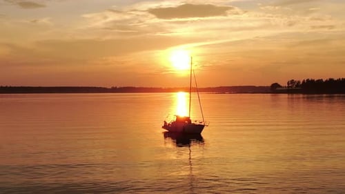 Sailboat on Lake at Sunset