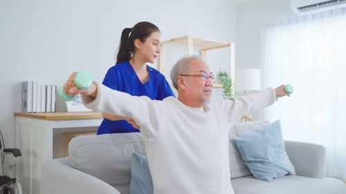 Senior Adult Doing Physical Therapy with Young Adult