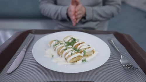 Sliced Pancakes with White Sauce and Dill