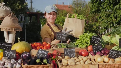 Woman Selling Fresh Produce at Farm Stand