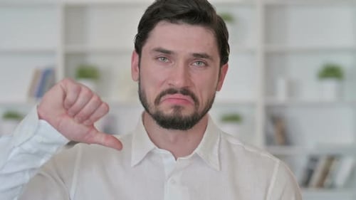 Man Showing Thumbs Down