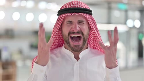 Man Shouts and Celebrates Wearing Traditional Clothing