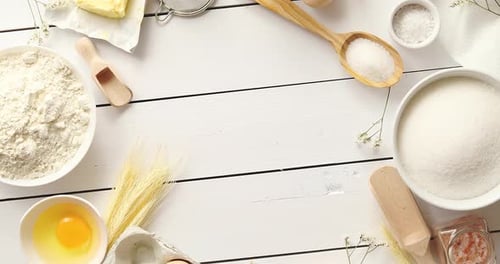 Overhead View of Baking Ingredients on Wooden Surface