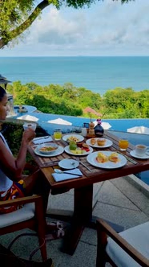 Breakfast on the Beach in Thailand a Luxury Breakfast Table with Food and Beautiful Tropical Sea