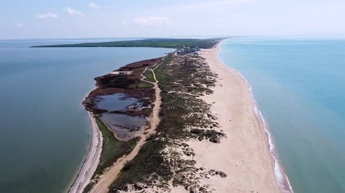 A long sandy spit with a beautiful azure sea