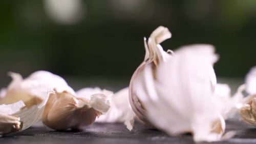 Whole Garlic Bulbs and Garlic Skin Is Blown Away.