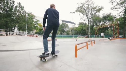 Skateboarder in Skate Park Doing Tricks Slow Motion