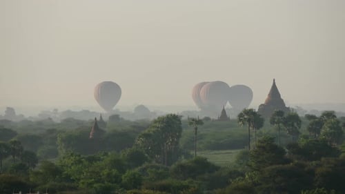 Time lapse from Balloons landing together close to the Pagodas in Bagan