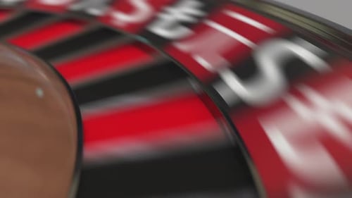 Ball in Rupee Sign Pocket on Casino Roulette Wheel