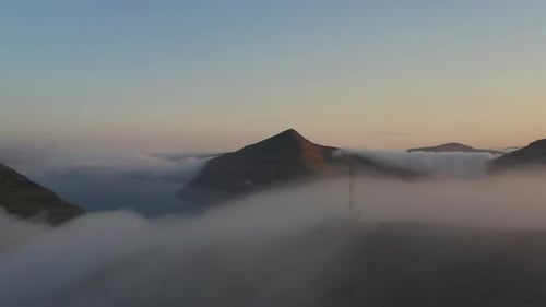 Mountains Emerging Through Cloudscape at Sunrise