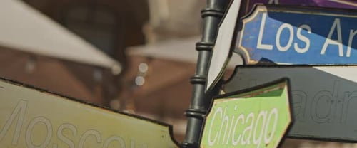 Colorful City Signs Point in Different Directions