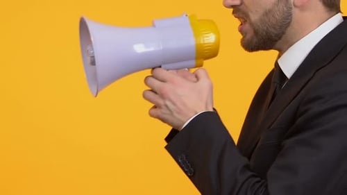 Irritated Man Shouting in Megaphone, Protest Campaign, Election, Side-View