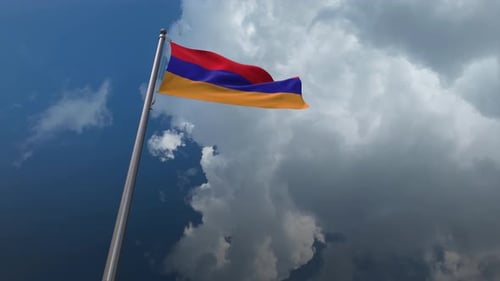Armenian Flag Waving in Wind Against a Cloudy Sky