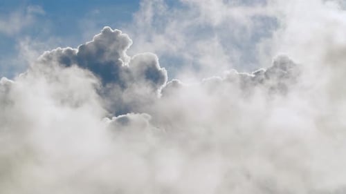 Bright Clouds Drifting in a Blue Sky