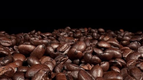 Dolly shot Close up of brown coffee beans.