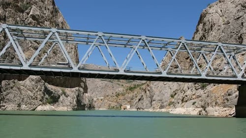 Iron Car Bridge Between Mountains Above River