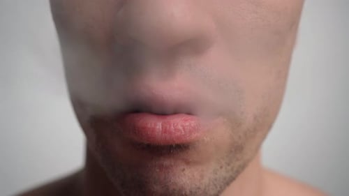 Close up of Man Using a Vape Device