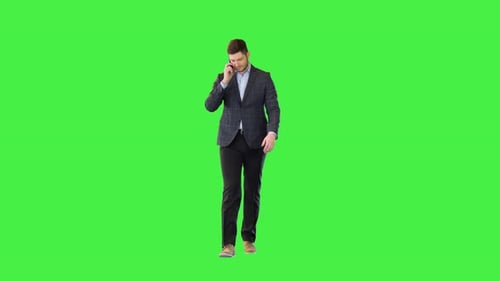 Man Walking and Talking on Cellphone on Green Screen