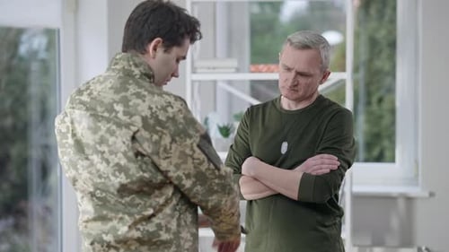 Comforting Adult and Young Adult in Military Uniform