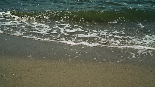 Coastal Sea Waves Lapping on the Sandy Shore