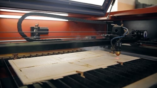 Laser Cutter Precisely Etching Wood Design