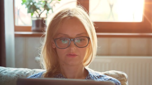 Woman Uses Tablet Device Indoors