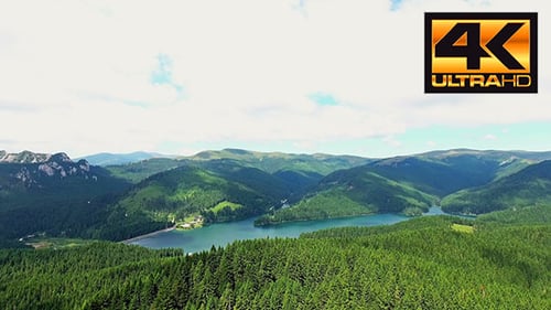 Fly Over Mountain Lake In A Sunny Day