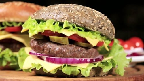 Hamburgers Stacked with Fresh Vegetables and Cheese