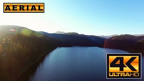 Fly Over Mountain Lake At Sunset