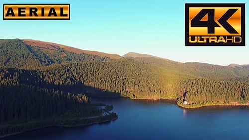 Fly Over Mountain Lake At Sunset