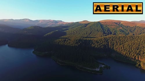 Fly Over Mountain Lake At Sunset