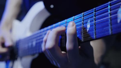 Guitarist`s Hands Playing on Guitar