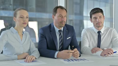 Executive Business People Having Conversation on Office Desk