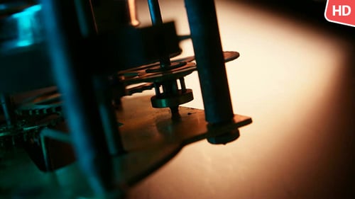 Intricate Clock Gears Turning in Dramatic Lighting