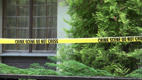 Crime Scene Tape in Front of Building