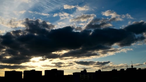Clip Of Sunset Fluffy Clouds Over Blue Sky Over The City