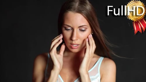 Glamorous Woman Posing with Hair and Lingerie