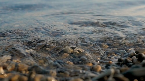Sea Braking Against Stones and Pebbles on a Beach, Waves of Pure Water