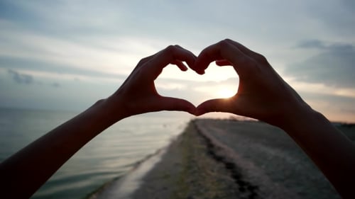 Hands Show Heart At Sunset