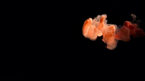 Beautiful Cloud Orange Dye Dissolved In Water