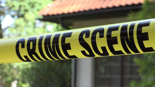 Crime Scene Tape Near a Suburban Home