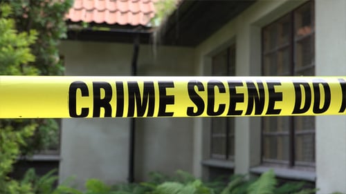 Crime Scene Tape Outside Suburban Home