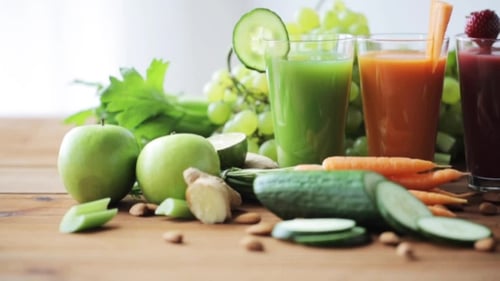 Colorful Fruit and Vegetable Juices on Wooden Table