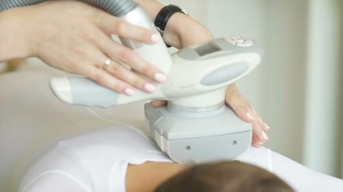 LPG Massage In The Beauty Center. Woman Lying On The Bed In a Spa Salon